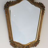 Old mirror gilded wooden frame and polychrome décor.