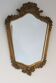 Miroir ancien cadre en bois doré et décor polychrome.