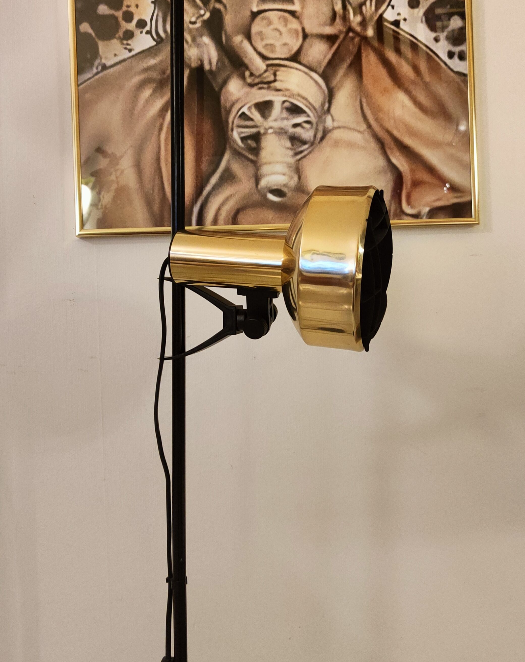 Black floor lamp is gold vintage 1980