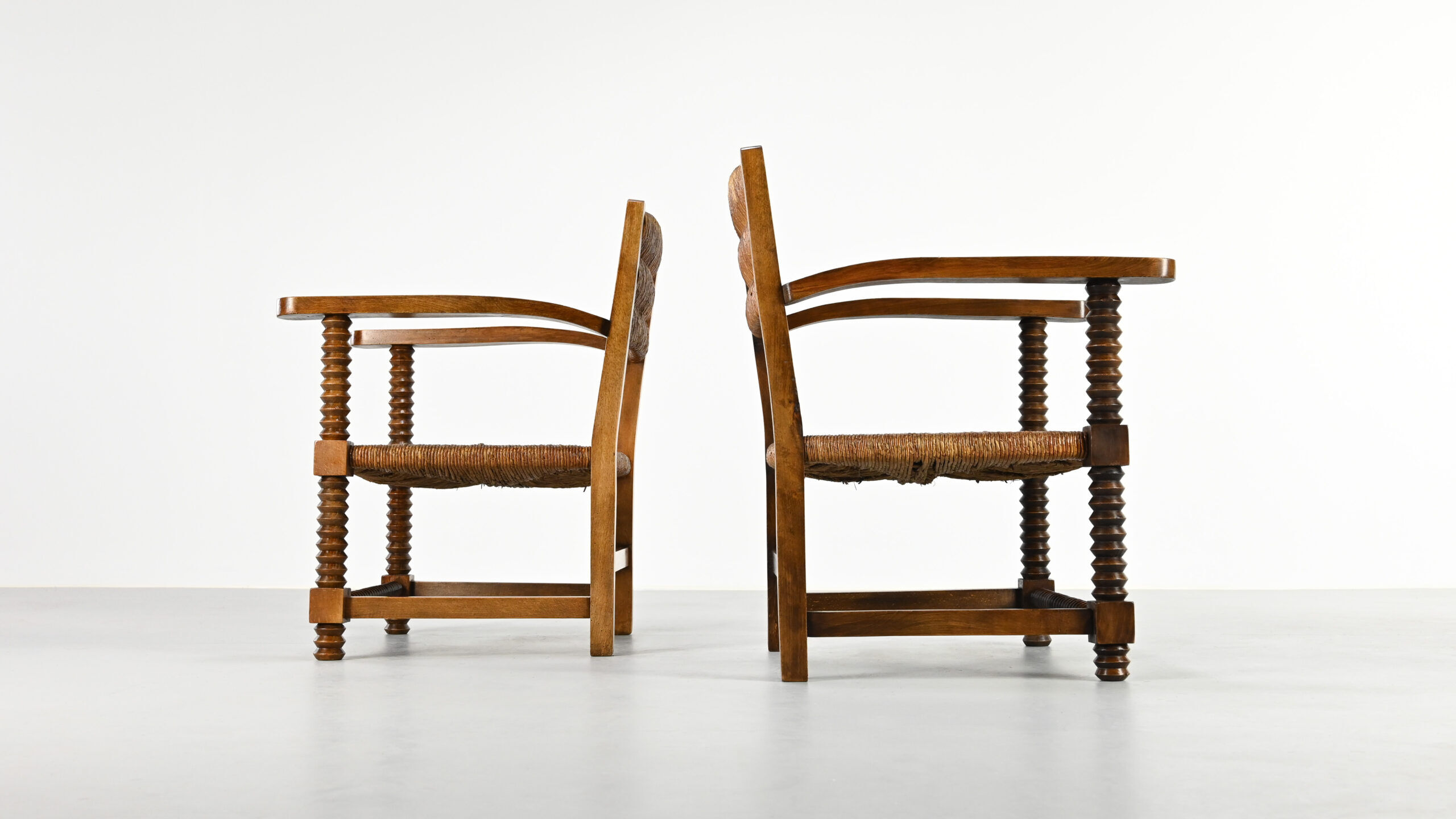 Pair of French armchairs with twisted legs in the style of Charles Dudouyt, France, 1940s.