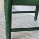 Vintage children's chair in green wood with a woven straw seat