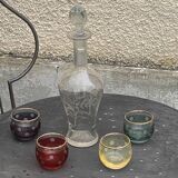 Liqueur carafe, or aperitif, carved with floral decoration in transparent glass and 4 polka dot glasses