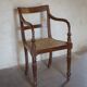 Fauteuil indonésien en acajou et cannage