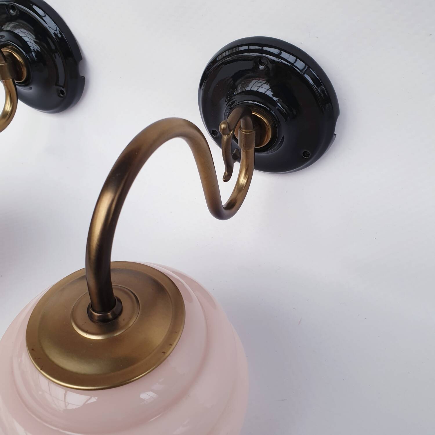 Swan neck wall lights in brass and glass