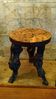 Brutalist tripod stool made from vine stock.