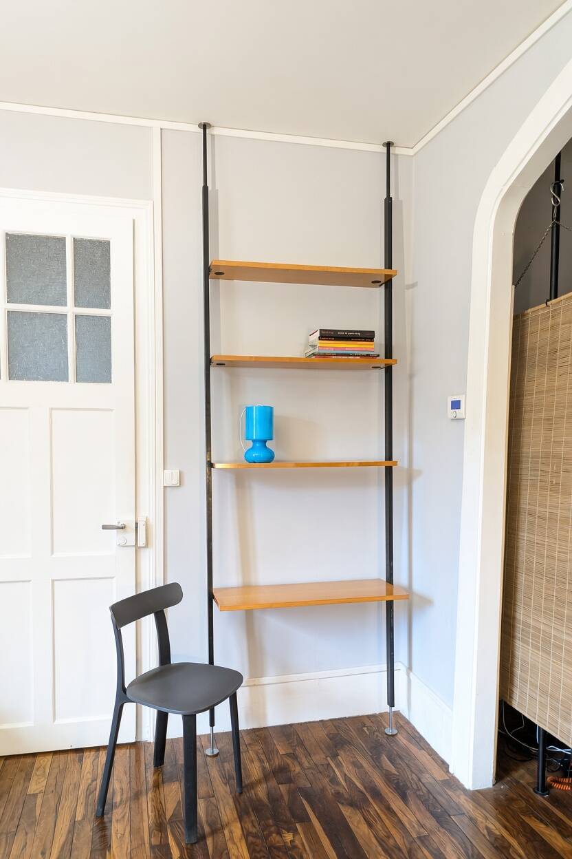 Modular floor-to-ceiling shelf for Wohnbedarf, Switzerland, 1960.