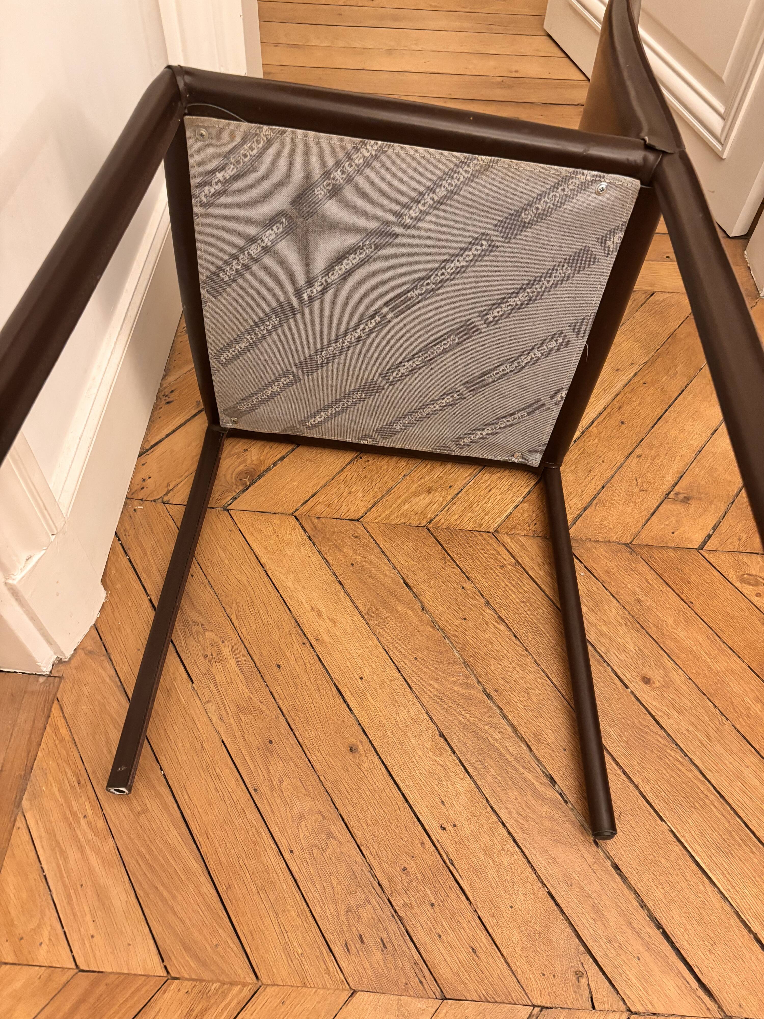 Many brown leather chairs "Roche Bobois"