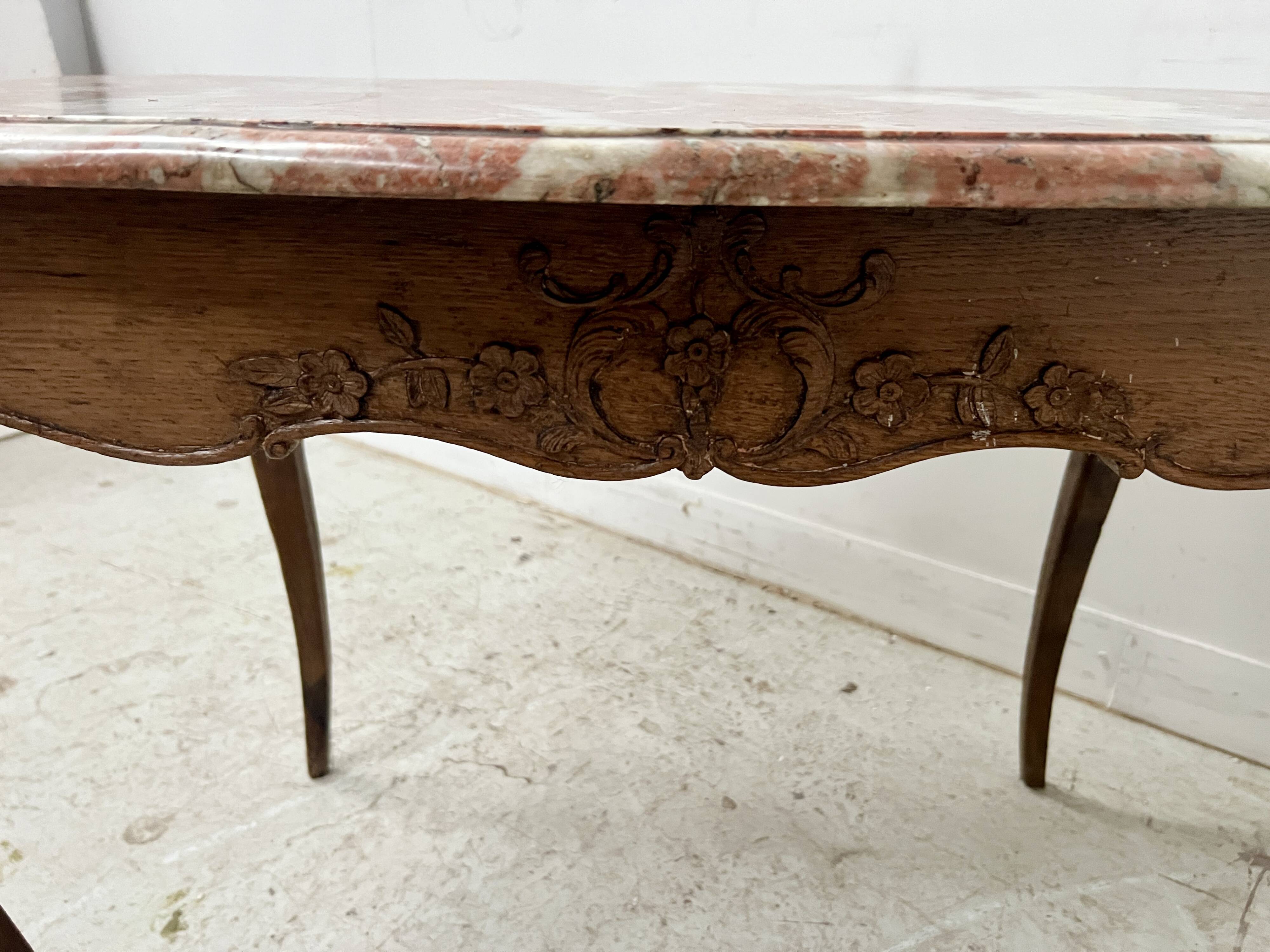 Louis XV mid-table in oak and marble, 18th century.