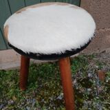 Antique tripod stool in wood and cowhide
