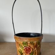 Metal basket with rose patterns