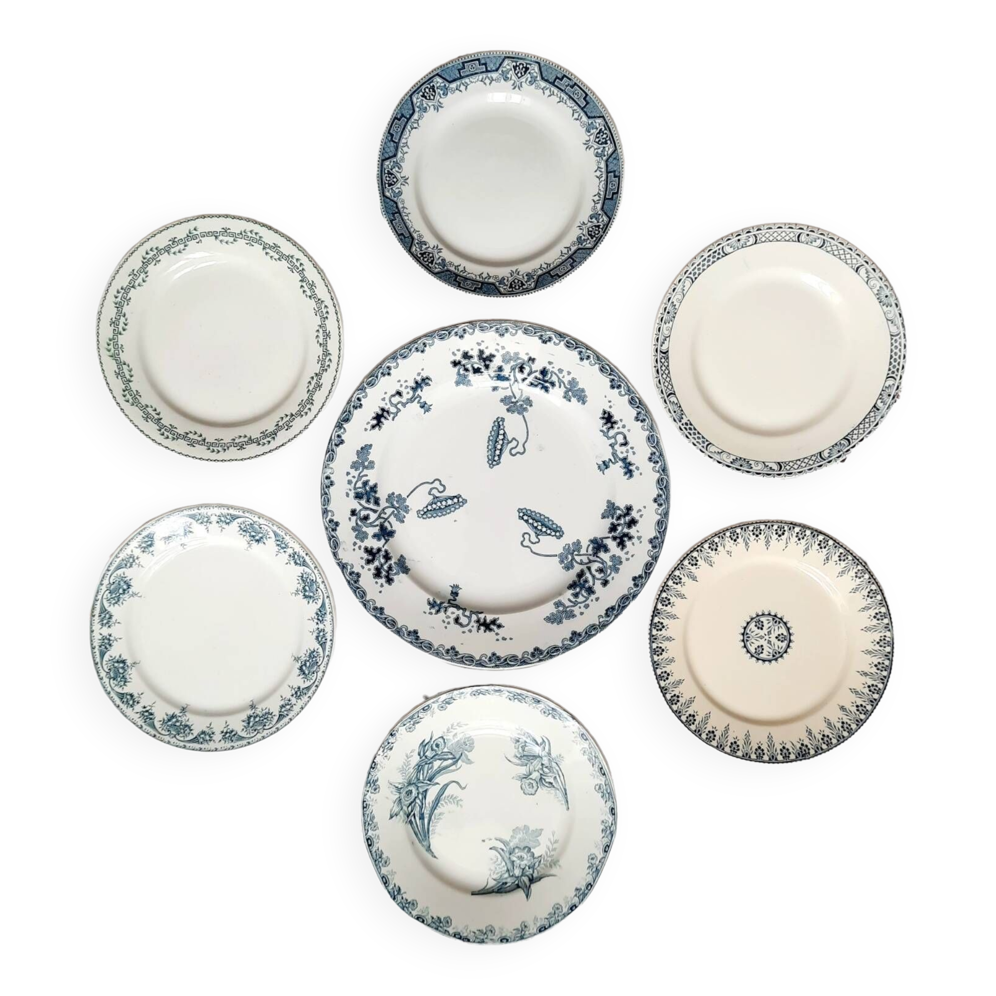 Old mismatched iron earthenware dessert plates accompanied by a dish