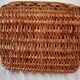 Old wicker basket with diamond-shaped decorations