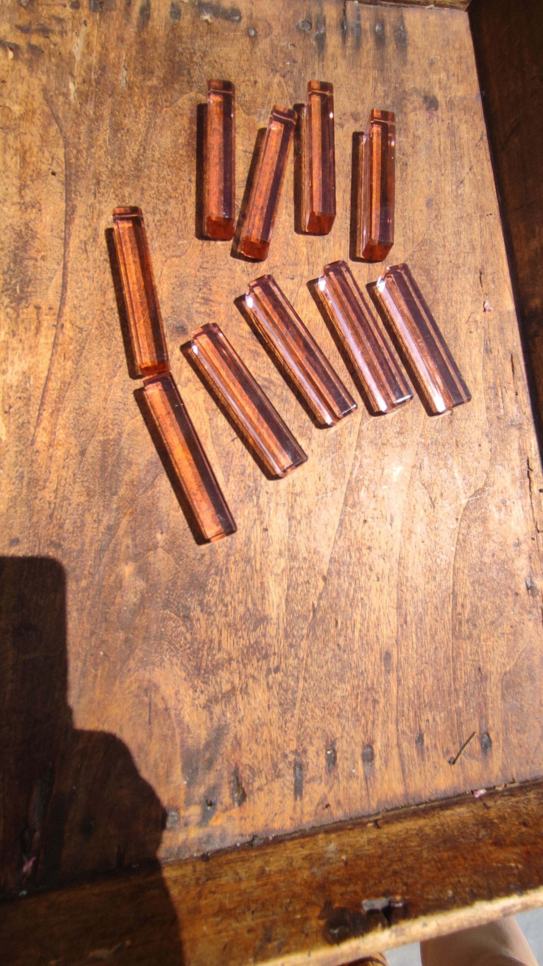 Ten pink glass knife holders