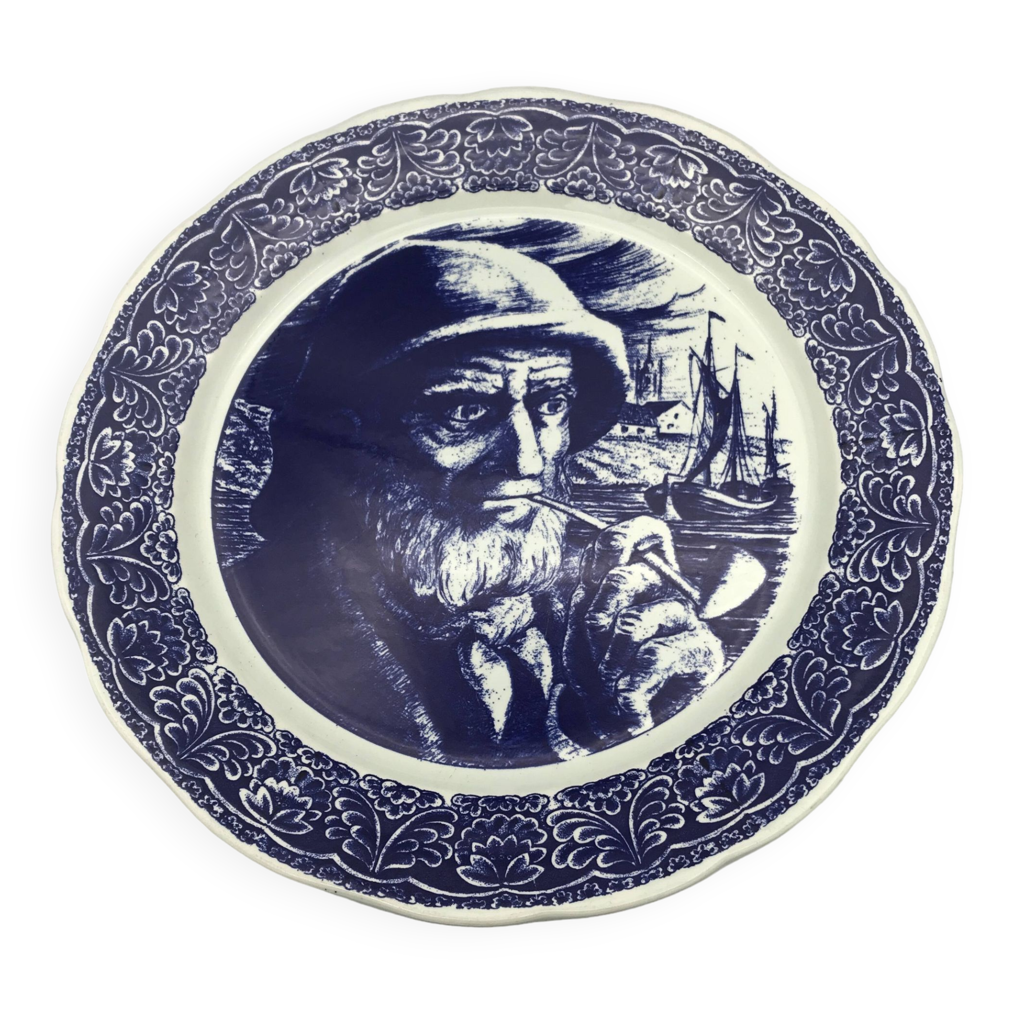 Blue enamelled earthenware wall plate with fisherman decor, Boch La Louvière, Belgium