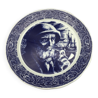 Blue enameled earthenware wall dish with fisherman decor, boch la louvière, belgium
