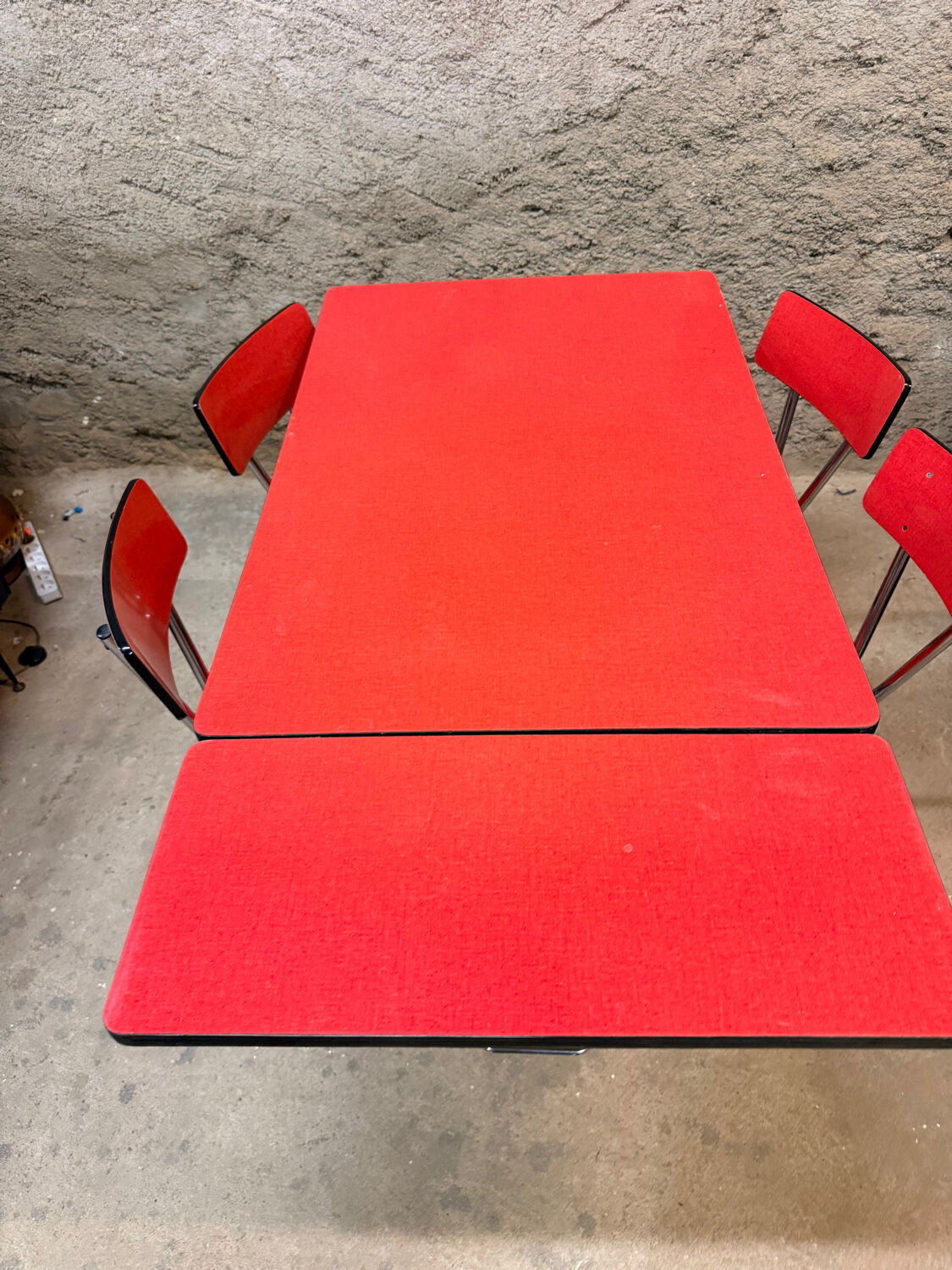 4 red Formica chairs with a 1970s table