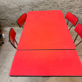 4 red Formica chairs with a 1970s table