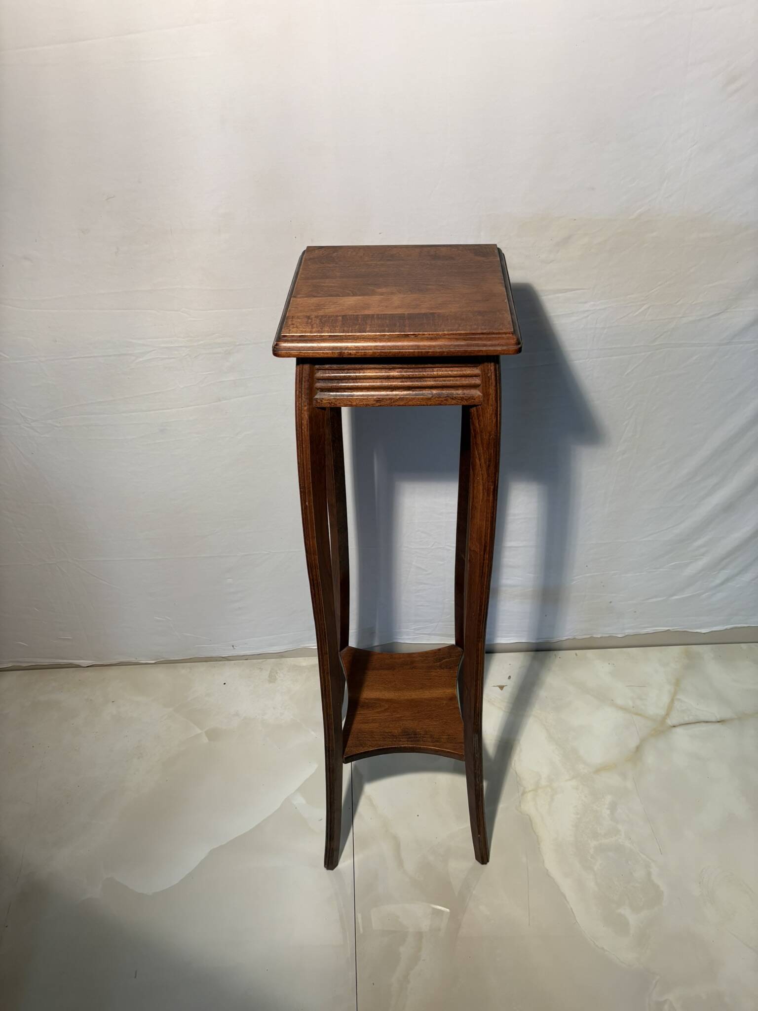 Vintage dark wood side table with curved base