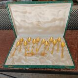 12 small golden spoons