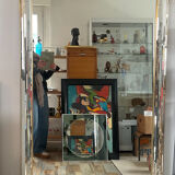 Large vintage Hollywood Regency style mirror with shutters.