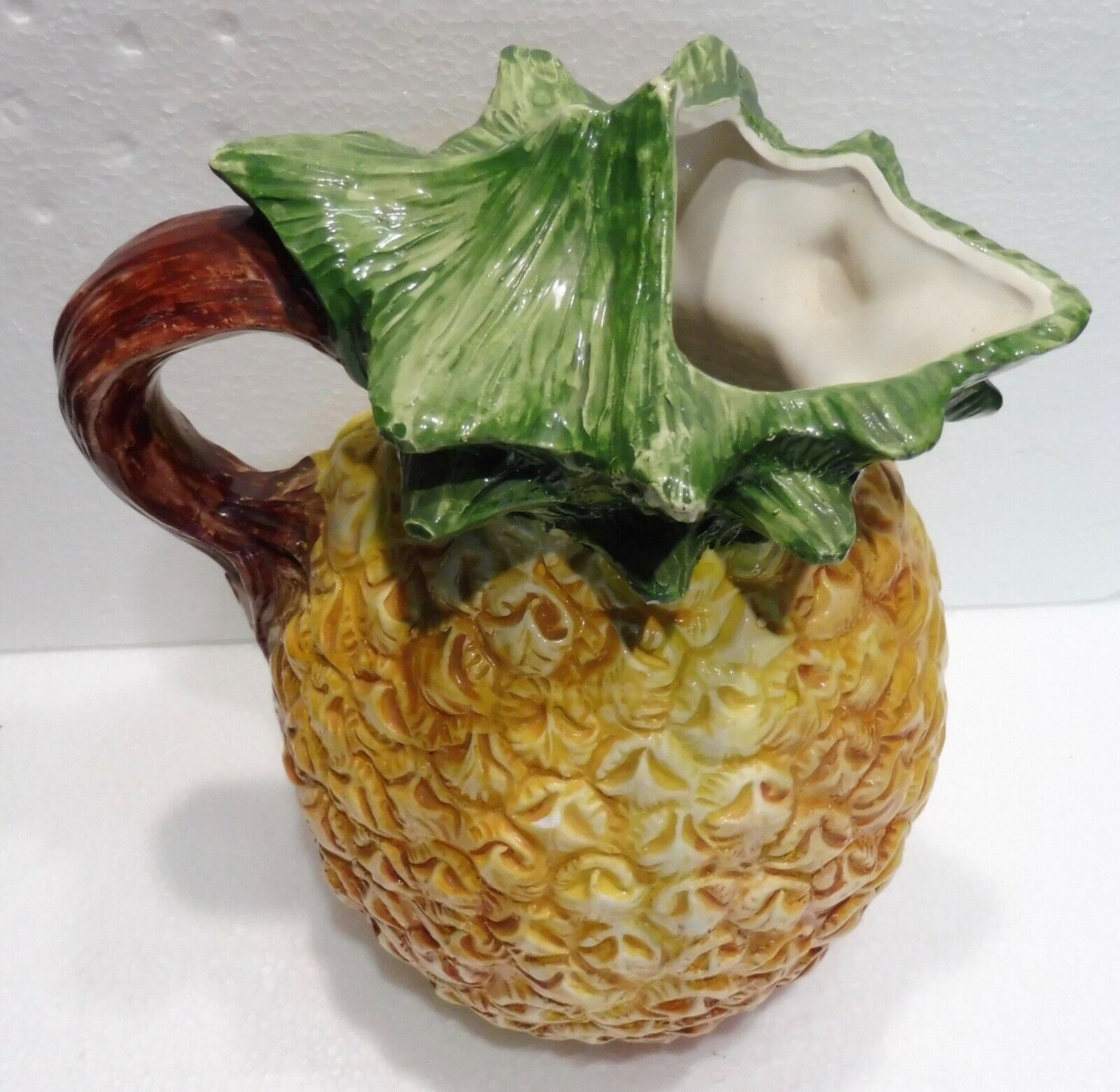 Pitcher on pineapple earthenware