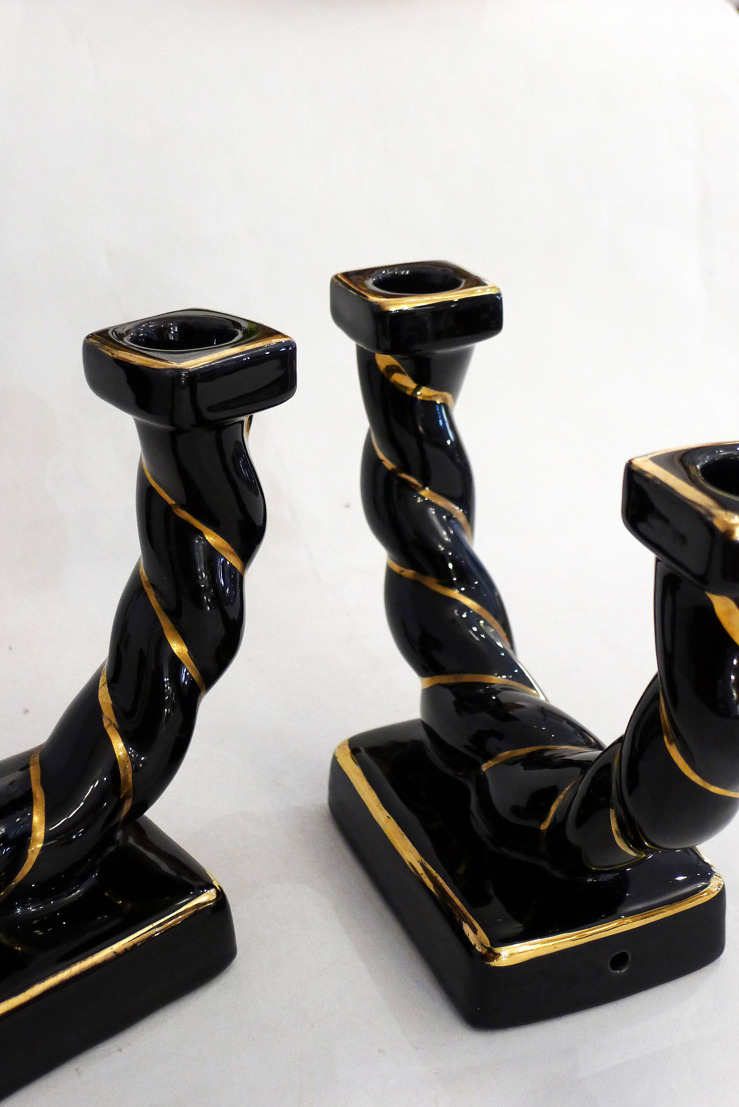 Pair of earthenware braided rope candlesticks