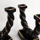 Pair of earthenware braided rope candlesticks