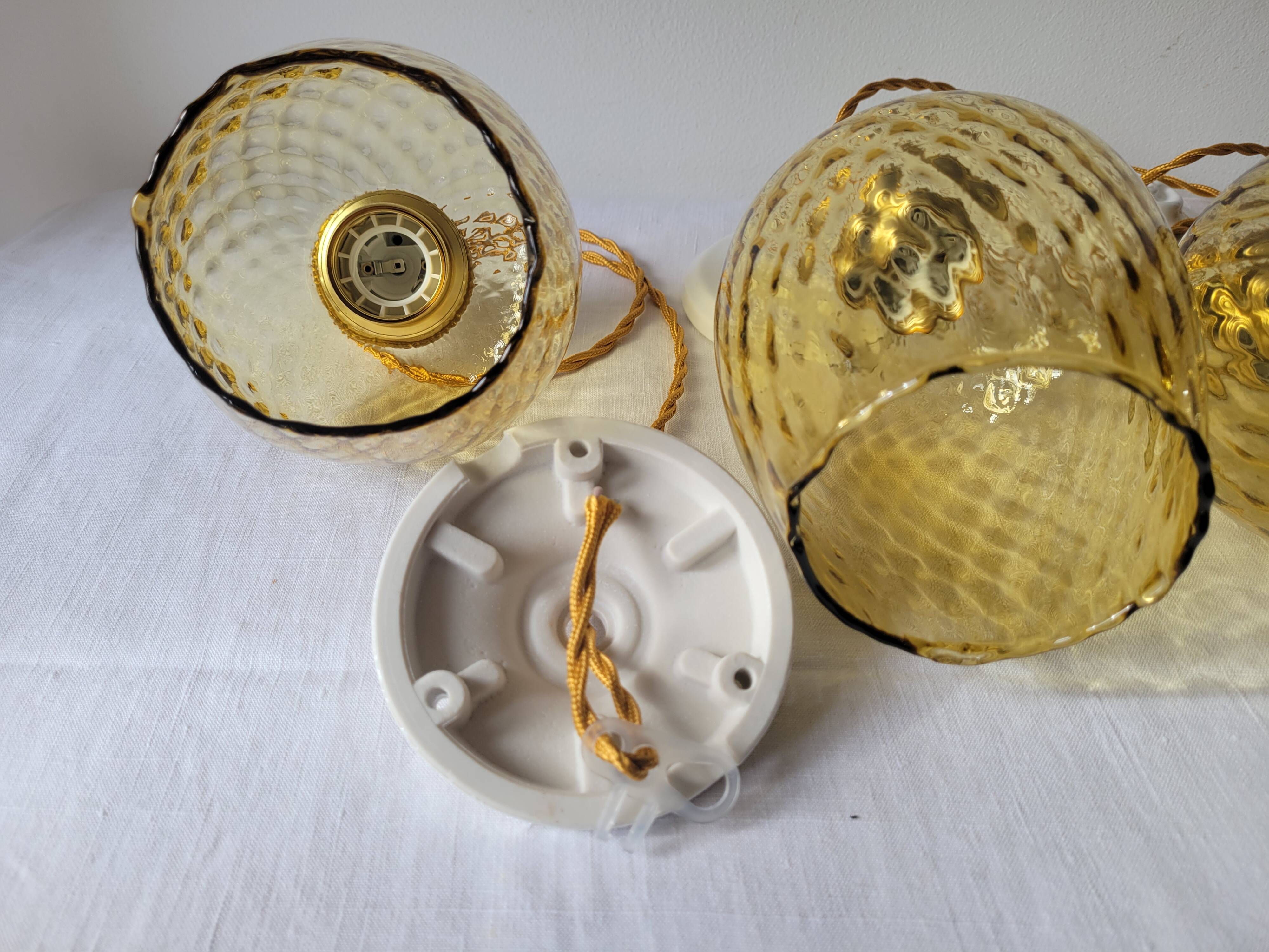 Trio of yellow glass pendant lights