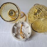 Trio of yellow glass pendant lights