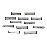 Série de 12 porte couteaux Art Déco modernistes en métal chromé et bois noirci