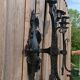 Pair of black wrought iron wall sconces - neo-Gothic style - from the 1950s
