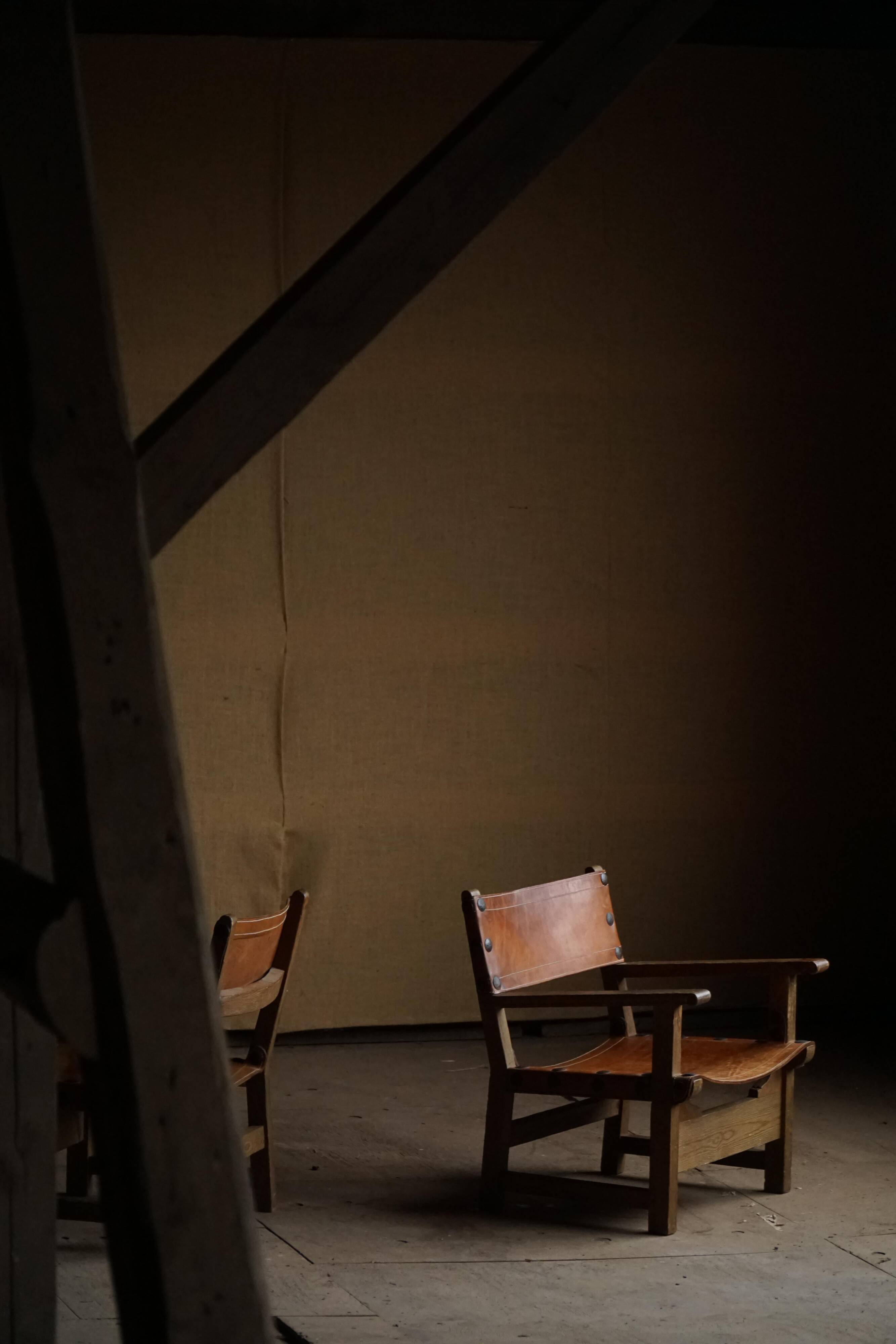 Pair of Spanish brutalist armchairs from the 1960s, wood and leather.