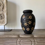 Wooden vase with flower pattern