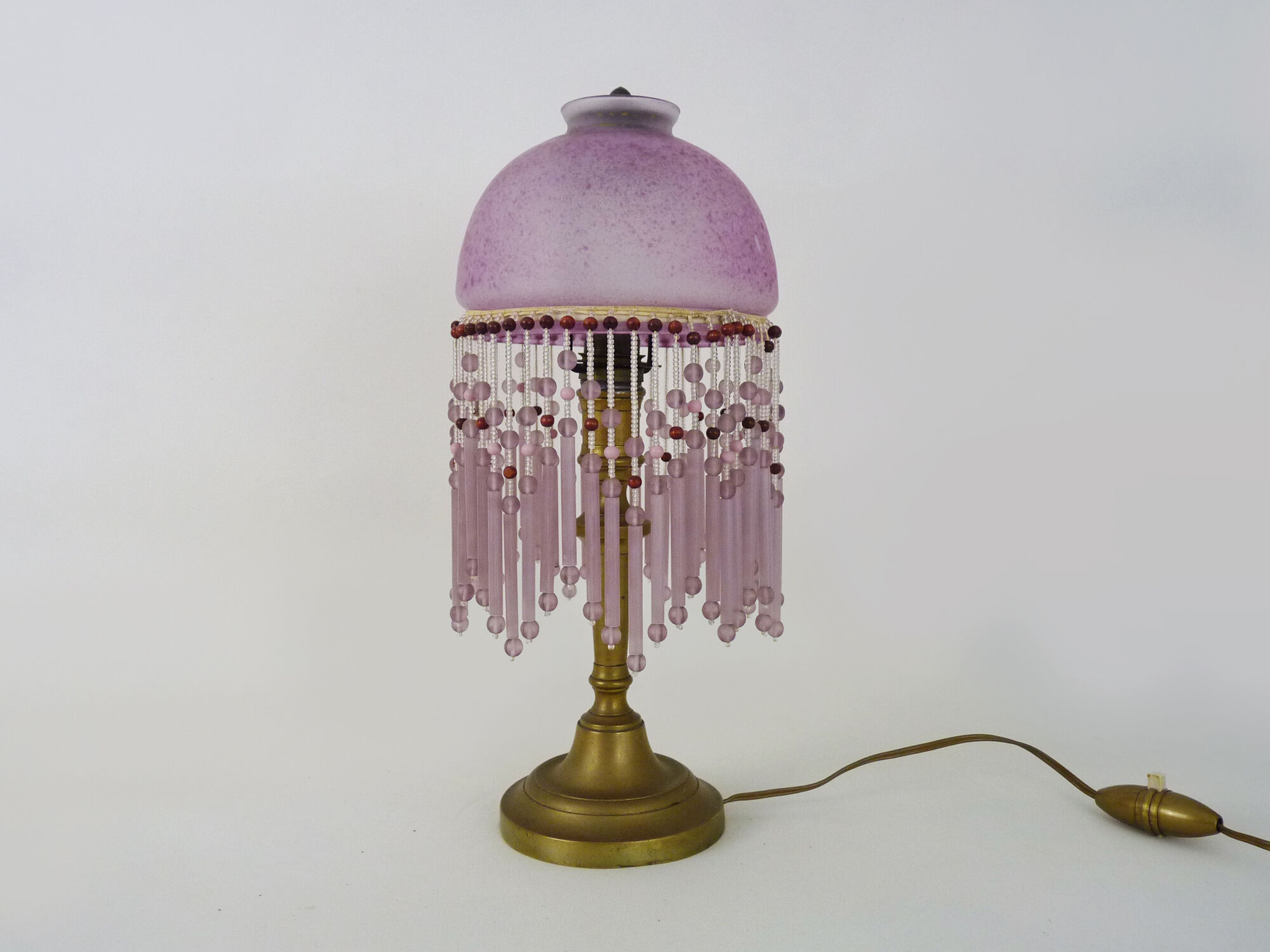 Table lamp, bedside lamp, speckled pink globe and glass and wood beads. Year 60