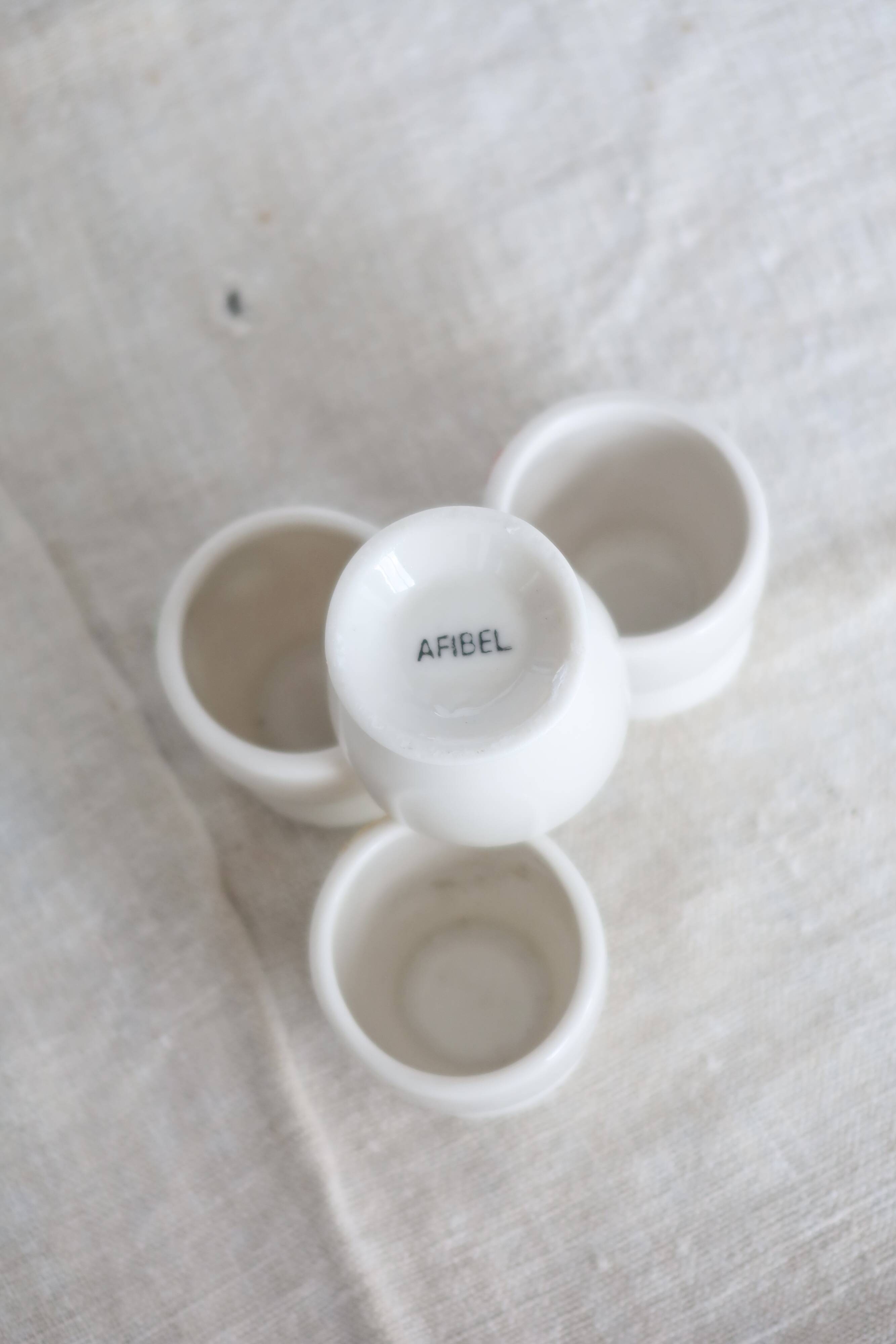 4 vintage Afibel porcelain egg cups - Barbotine decor