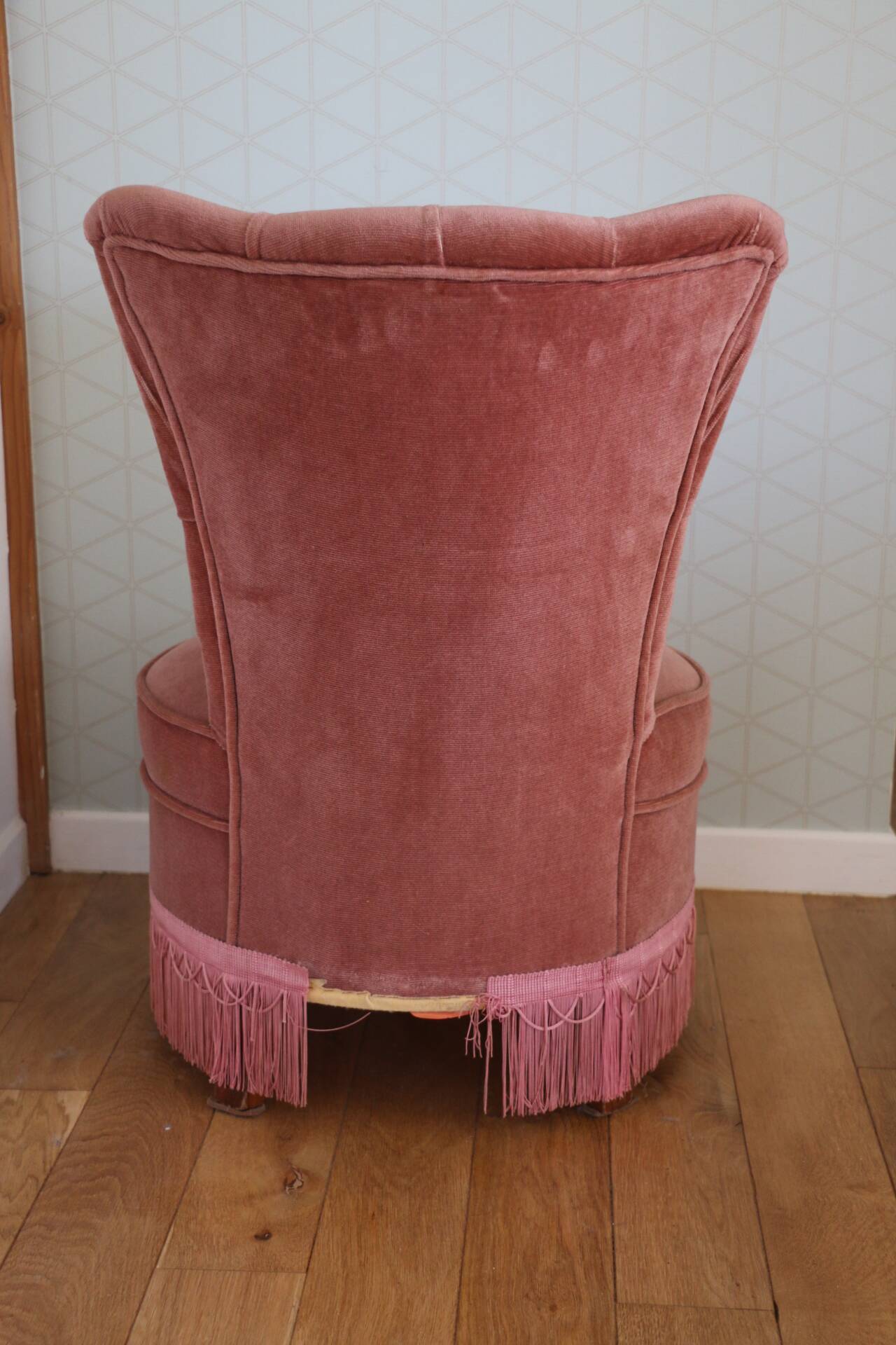 Powder pink fireside chair with fringes