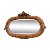 Beveled mirror in carved wood