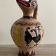 Clay pitcher with a bird head