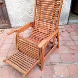 Teak stretchy long chair.