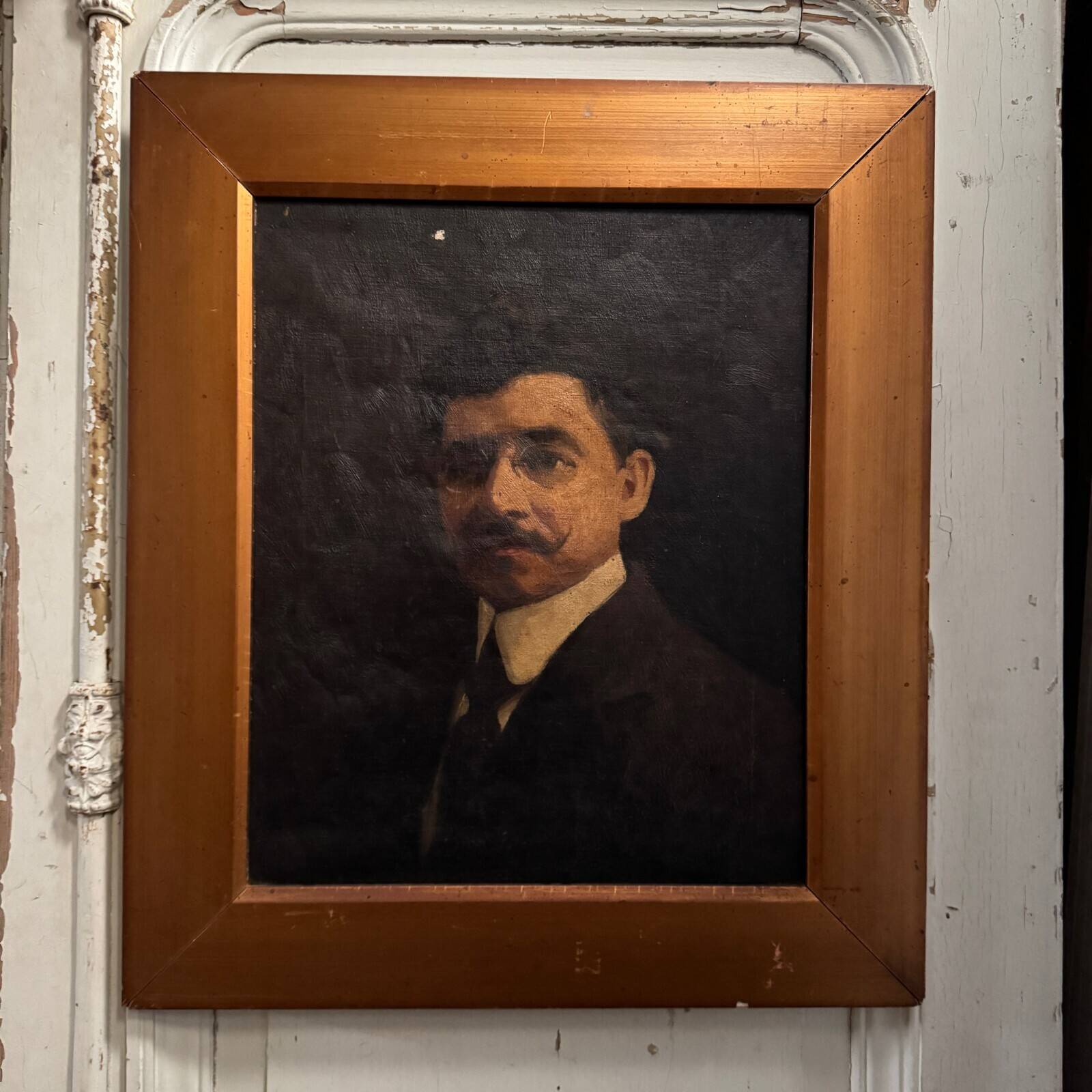 Oil on canvas portrait of a man wearing glasses and a mustache, early 20th century