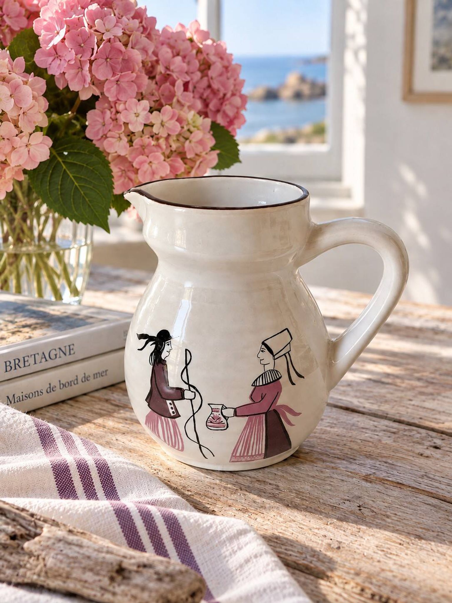 Ceramic pitcher from Quimper, created by Dominique Villard.