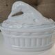 White porcelain terrine with white goose