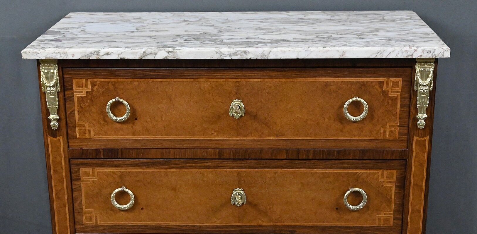 Small chest of drawers in amboyna and rosewood, Louis XVI style – 1940