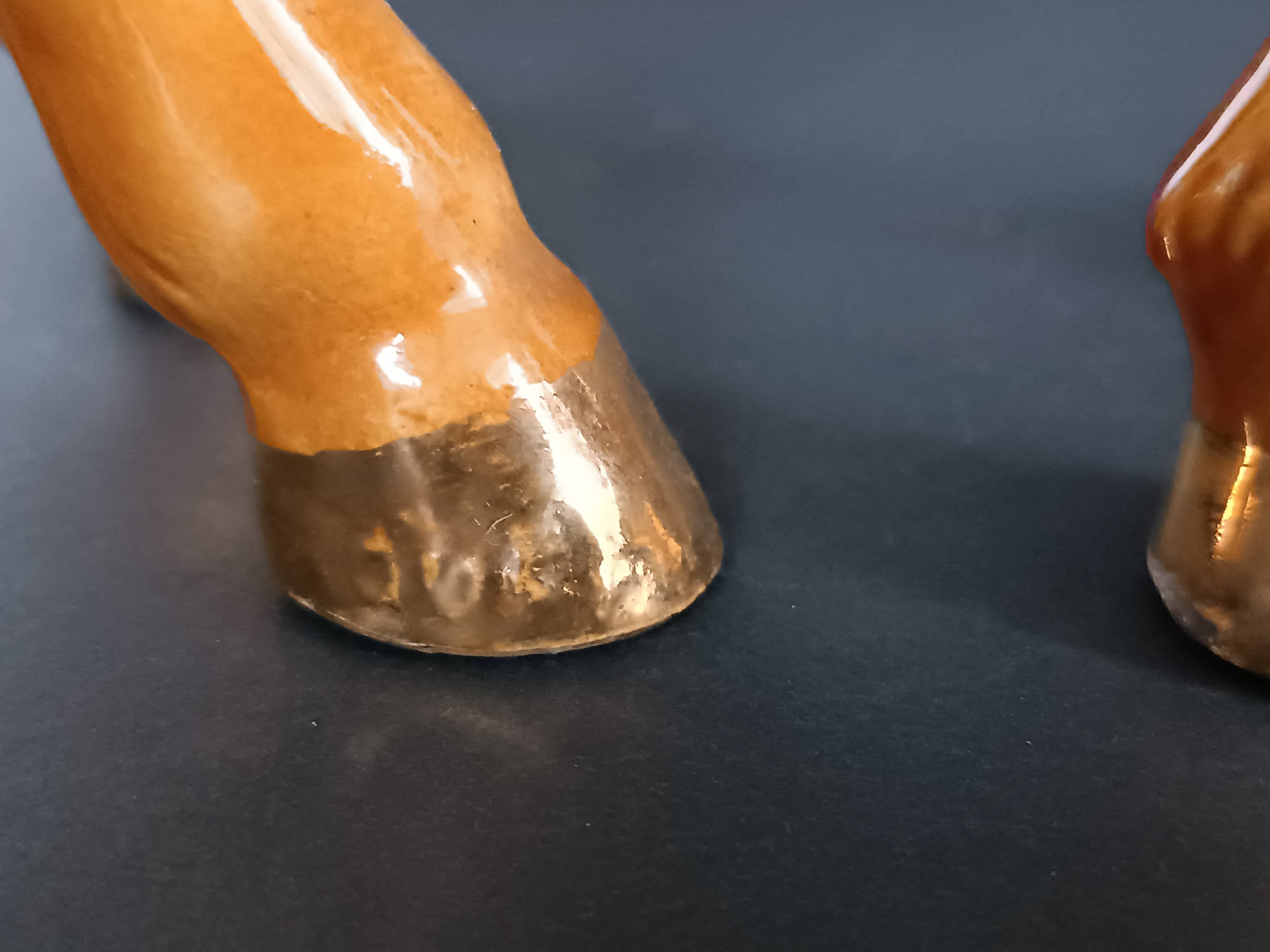 Ceramic horse sculpture with wild glaze and gold, signed Art Deco.