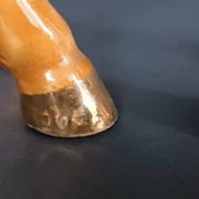 Ceramic horse sculpture with wild glaze and gold, signed Art Deco.