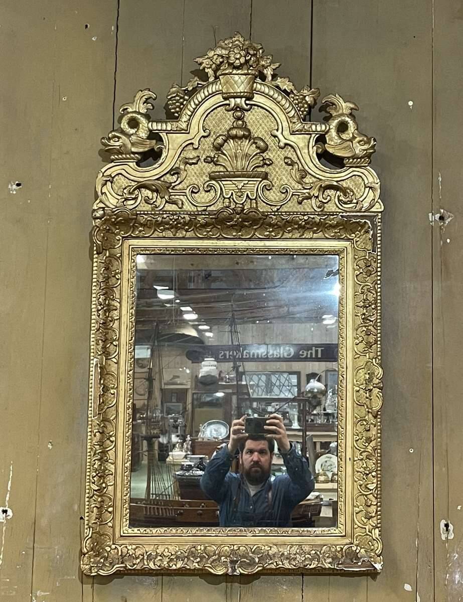 18th century Regency mirror in gilded wood