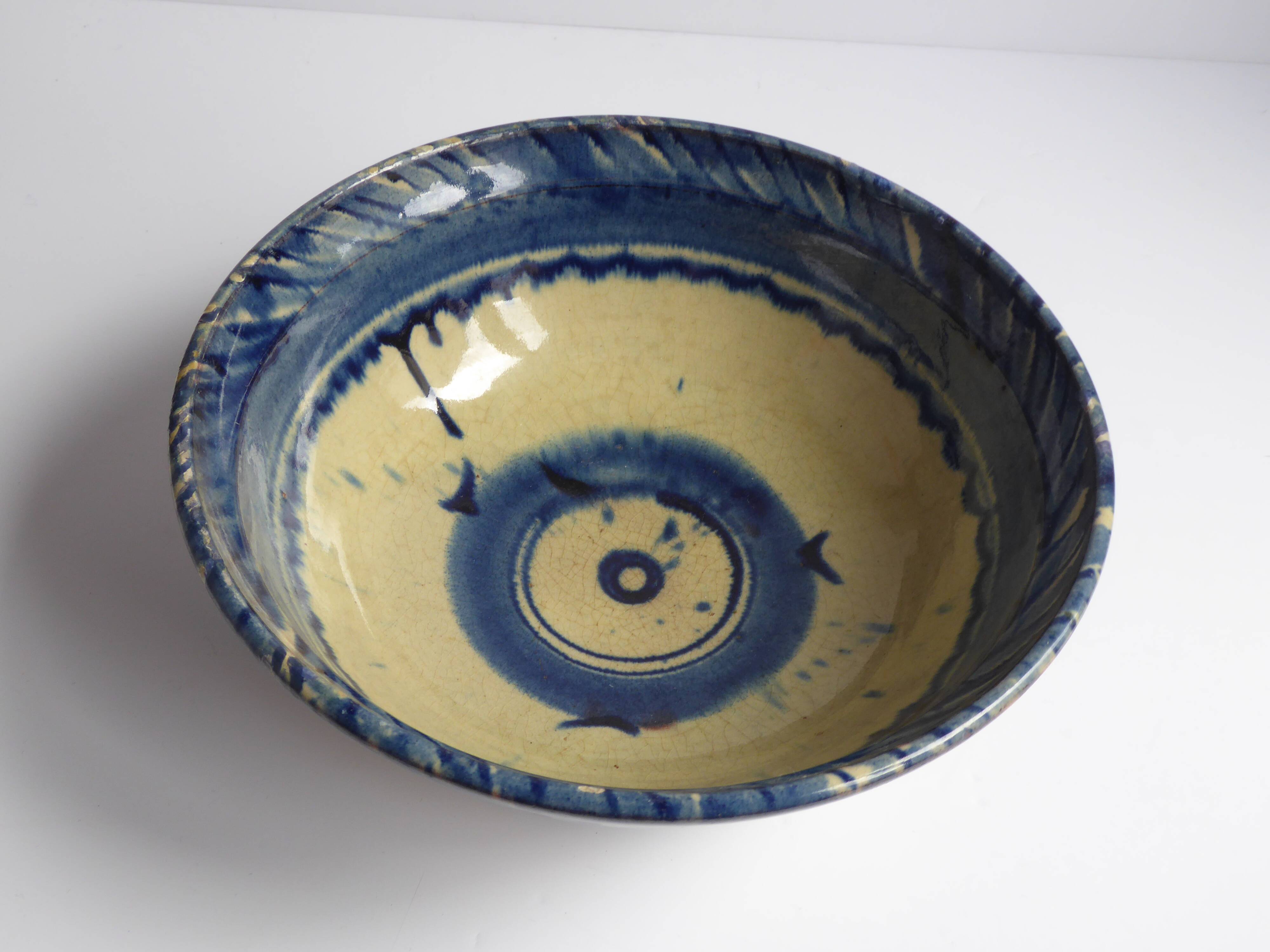 Blue enamelled terracotta cup