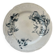 Flat earthenware plate with floral motifs