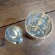 Silver-plated cup and egg cup set with floral decoration.