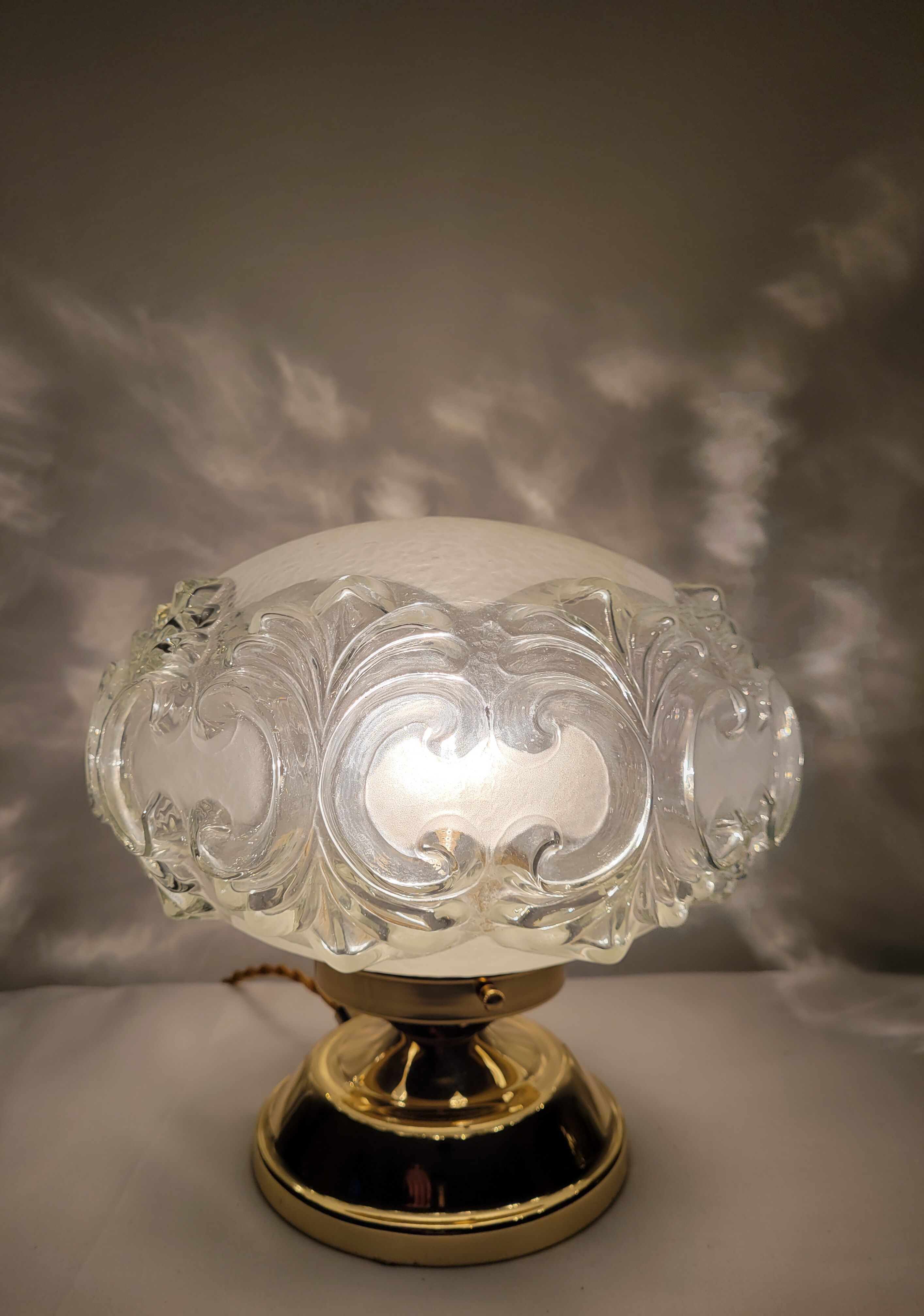 Brass lamp with molded glass globe